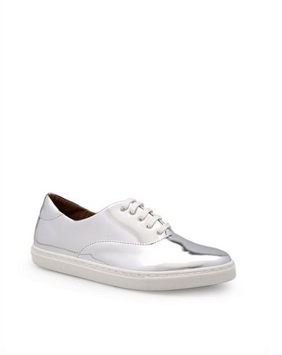 These playful,
high-shine sneakers offer a flashy finish to any workday outfit. Match them
back with a classic LBD and relaxed blazer or pair them with simple monochrome separates
for corporate cool. &nbsp;<br>
<br>
Country Road
Riley sneaker, $129. <a href="https://www.countryroad.com.au/shop/woman/shoes/sneakers/60196027-901/Riley-Sneaker.html" target="_blank">Countryroad.com.au</a><br>