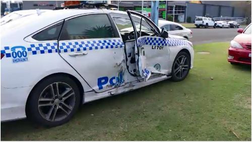 Two police officers have been injured following an alleged violent carjacking on the NSW South Coast. 