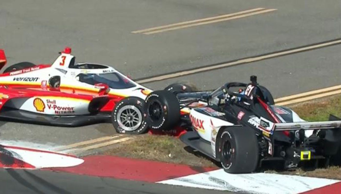 Scott McLaughlin (left) crashes out of his IndyCar debut in Florida.