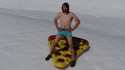Rock climber Ethan Pringle prepares to ride down the iceberg. (Instagram)