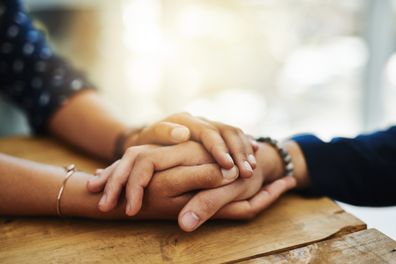 Friends holding hands 