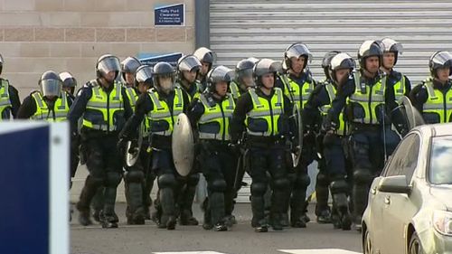 Armed officers were forced to enter the prison to subdue inmates. (9NEWS)