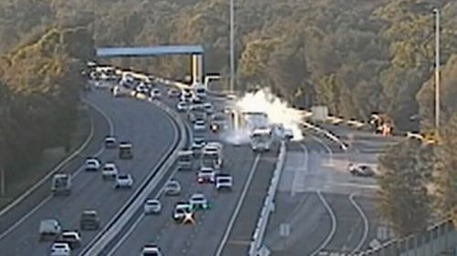 The accident caused a semi-trailer to jackknife on the busy M5 Motorway. (9NEWS)