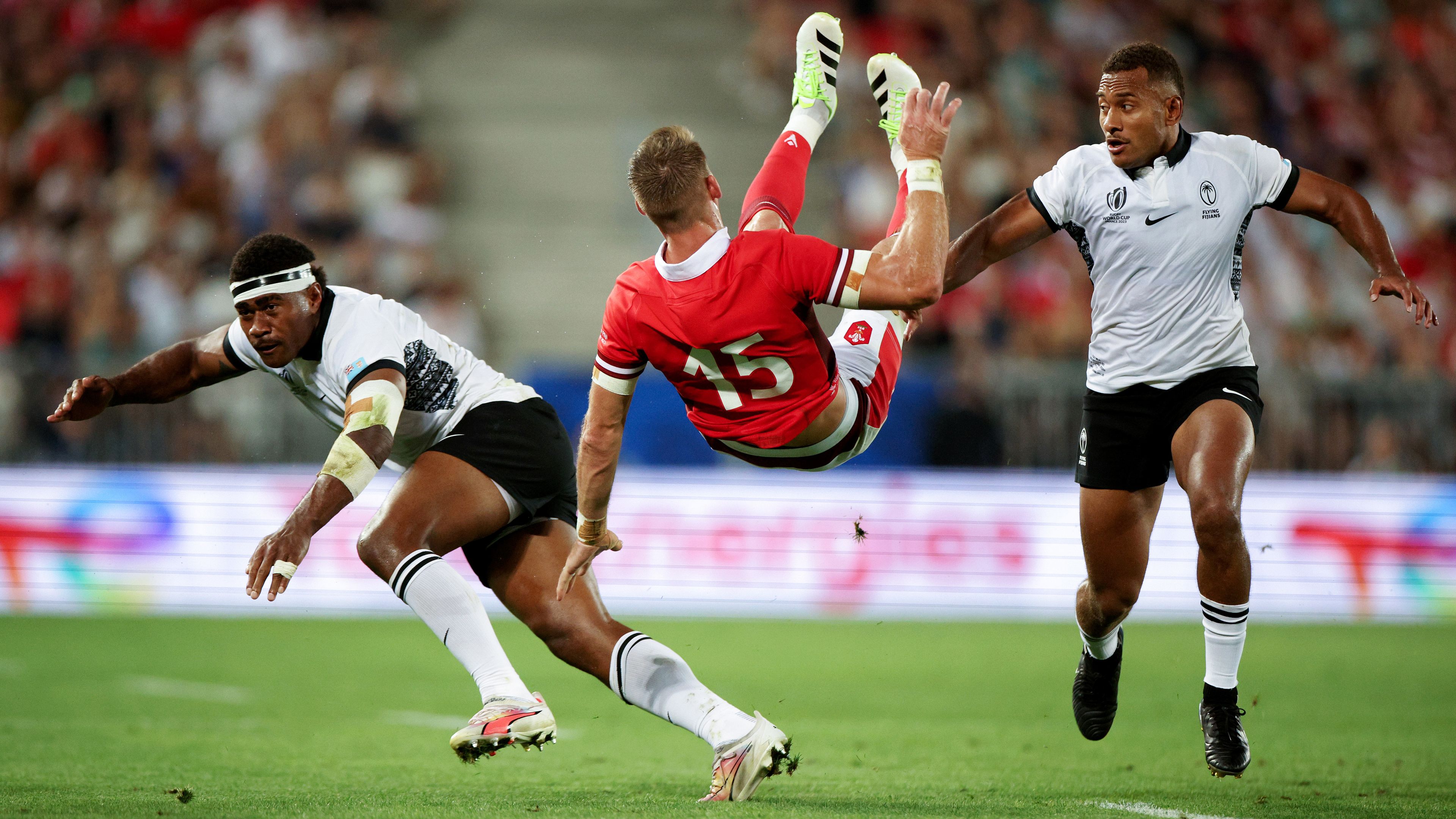 Vinaya Habosi of Fiji commits an illegal no arms challenge on Liam Williams of Wales.