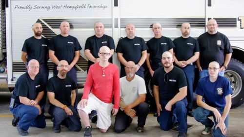 Volunteer firefighters shave heads for teen colleague battling cancer