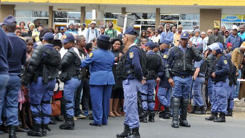 Protesters outside the Estcourt Magistrates Court during the appearance of suspects in the flesh-eating case last August. 