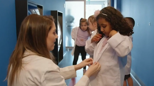 Pre-schoolers wear white science lab coats ready to learn about science and technology as part of Australia's first purpose built education hub for preschoolers.  