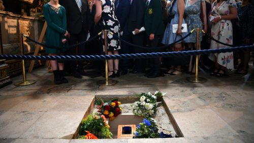 The ashes of Professor Stephen Hawking are laid to rest between the graves of Charles Darwin and Isaac Newton. Picture: Ben Stansall/PA via AP