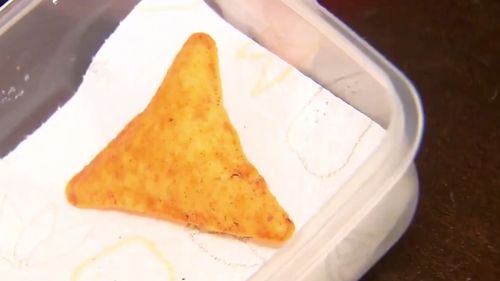 A Gold Coast teenager is looking to turn a three-dollar bag of Dorito's into an over $20,000 payday after finding a rare "puffy" version of the popular chip. 
