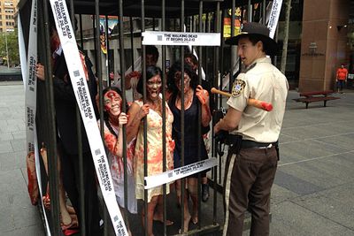 Fortunately, the zombies were confined to a cage... until they escaped for a "zombie walk" during the lunchtime rush-hour. (Certainly gives "food court" a whole new meaning.)