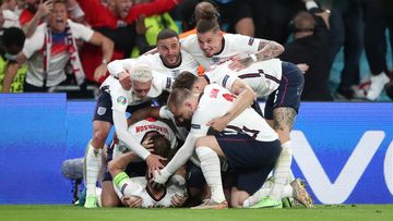England&#x27;s Harry Kane is mobbed by team-mates after scoring their side&#x27;s second goal of the game in extra-time during the UEFA Euro 2020 semi final match at Wembley Stadium, London. Picture date: Wednesday July 7, 2021. (Photo by Nick Potts/PA Images via Getty Images)