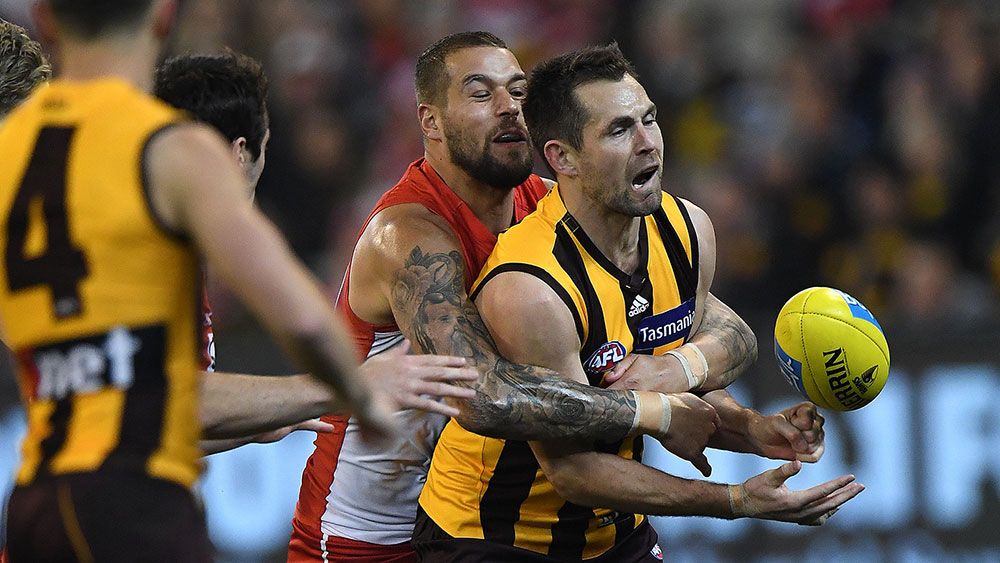 Hawks down Swans in tense AFL clash at MCG
