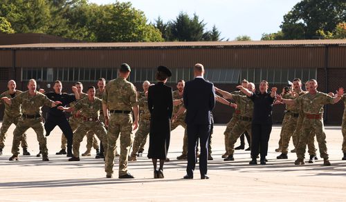 New Zealand troops perform a "Haka" for Prince William, Prince of Wales and Catherine, Princess of Wales.