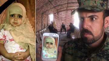 The father of Fatma Samir, 3, who was killed in a chemical attack, shows a phone picture of his daughter in Taza. (AAP)
