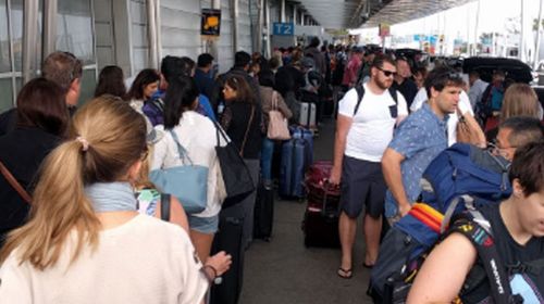 Virgin passengers stuck in 'world's longest check-in line' at Sydney airport