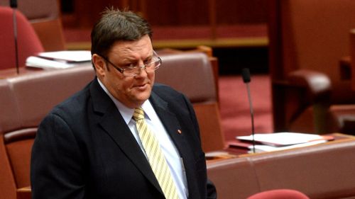 Palmer United Party senate leader, Senator Glenn Lazarus speaking in the Senate chamber at Parliament House Canberra. (AAP Image/Alan Porritt) 