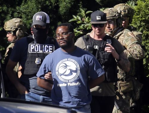 Salt Lake City police take Ayoola A. Ajayi into custody in connection with missing University of Utah student MacKenzie Lueck i (Kristin Murphy/The Deseret News via AP) 