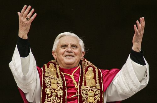 Pope Benedict XVI greets the crowd from the central balcony of St. Peter's Basilica at the Vatican on April 19, 2005, soon after his election. 
