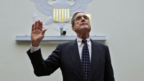 In this June 13, 2013 file photo, FBI Director Robert Mueller is sworn in on Capitol Hill in Washington prior to testifying before the House Judiciary Committee as it holds an oversight hearing on the FBI.