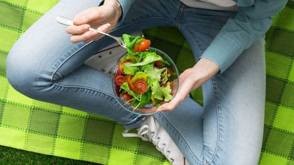 Woman eating salad