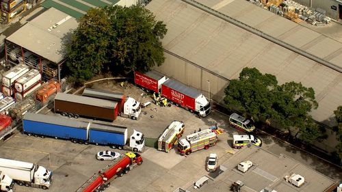 A person has been injured by a truck at a service station in Yagoona.