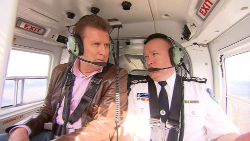 Peter Overton and Commissioner Shane Fitzsimmons in the RFS chopper. (9NEWS)