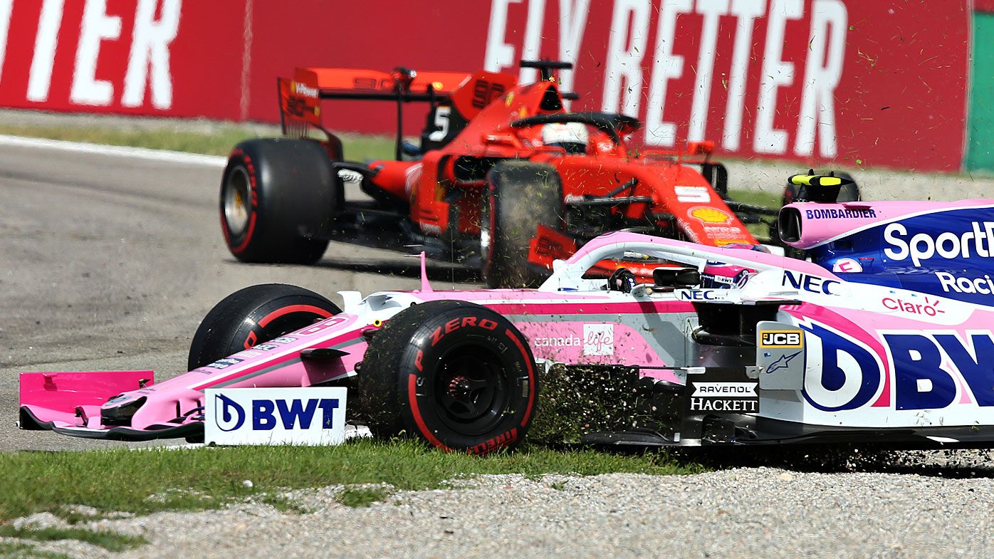 Lance Stroll of Canada driving the (18) Racing Point RP19 Mercedes spins with Sebastian Vettel