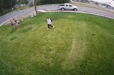 Kids cutting across lawn