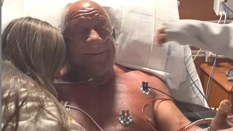 UFC great Mark Coleman is embraced by family in the hospital.
