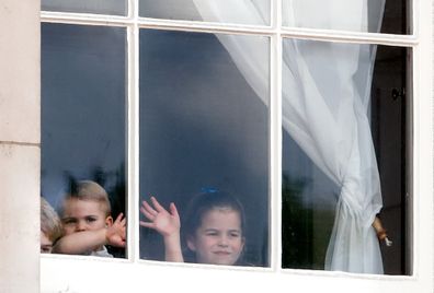 The Cambridge children waving from a window of Buckingham Palace ahead of Trooping The Colour.