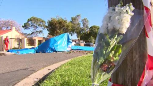 Flowers laid at the scene of the crash. (9NEWS)