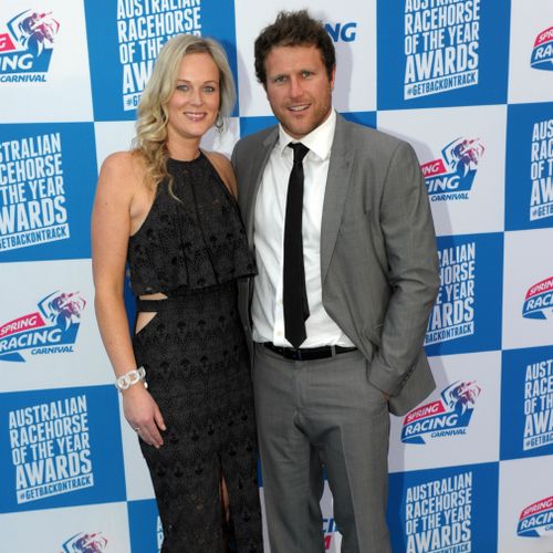 Campbell Brown and his wife Jess pose for photos at the launch of the Spring Racing Carnival at the Melbourne Museum in Melbourne in 2014. 