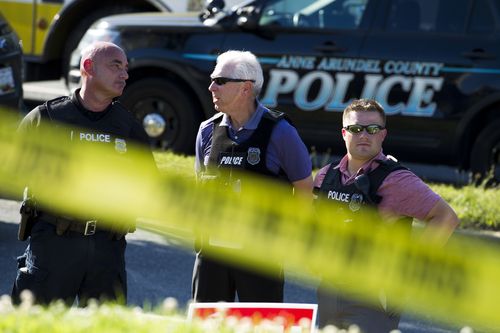 Officers have blocked off the streets around the building where the shooting occurred. Picture: AAP