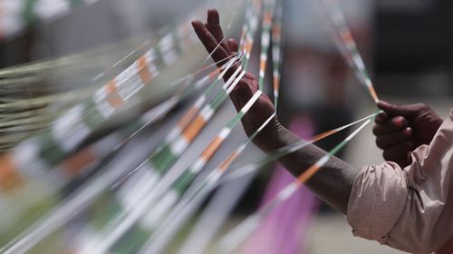 A file photo of kite strings in the national colours of India. Some strings are being laced with glass shards. (AAP)