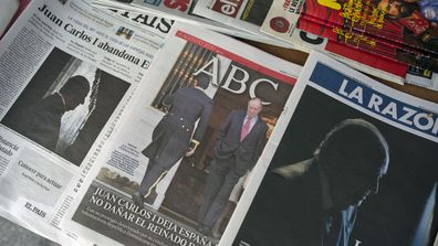 Front pages of newspapers are displayed with the news on Spain's former monarch, King Juan Carlos I, in Madrid, Spain, Tuesday, Aug. 4, 2020