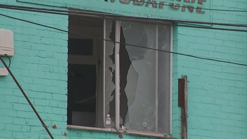 A shattered window in Sydney's inner-west after an alleged shooting 