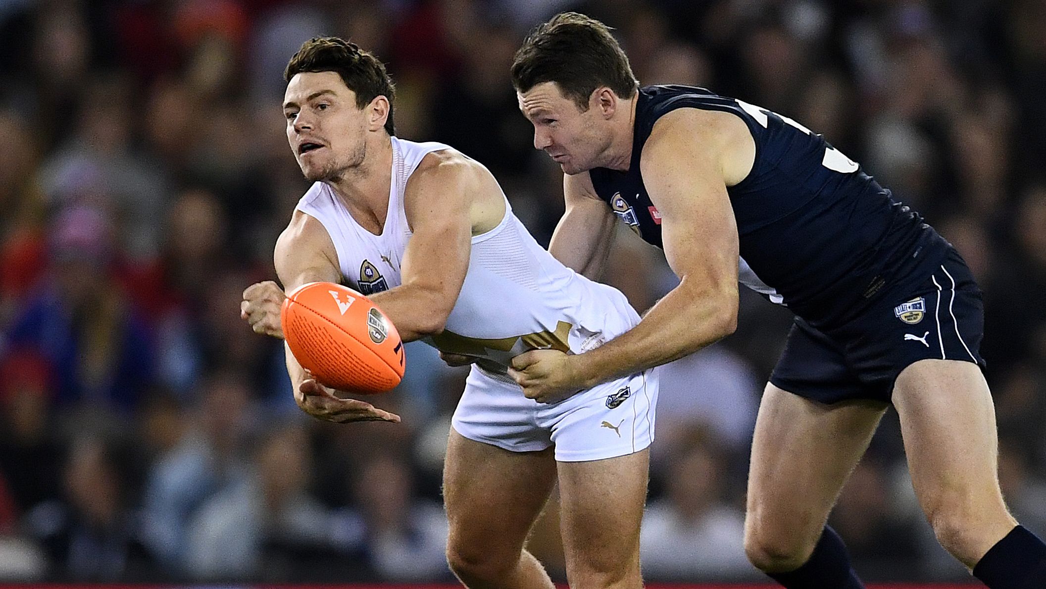 Lachie Neale of the All Stars is tackled by Patrick Dangerfield of Victoria during the 2020 AFL State of Origin.