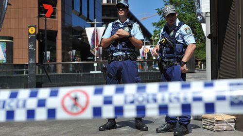 NSW Police are seen in Martin Place near the Lindt Cafe in the Sydney CBD. (AAP)