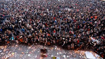 People attend a vigil in front of a memorial set on the 'Capitole' place in Toulouse, southern France. (AAP)