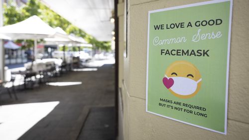 PERTH, AUSTRALIA - DECEMBER 24: A sign on display advises the public to the requirements of face masks on December 24, 2021 in Perth, Australia. The Western Australian government has implemented new COVID-19 restrictions, following the detection of a new community COVID-19 case. From 6pm on Thursday, masks will be mandatory in all public indoor settings in the Perth and Peel regions until December 28th. Authorities are also recommending people wear masks outdoors when physical distance can't be 