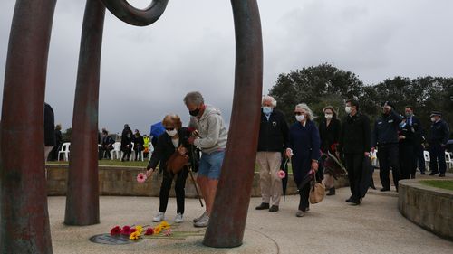 The memorial featured a sculpture by local artist Sasha Reid, depicting three interlinked cast-bronze shapes, symbolising life, growth, hope and the importance of strength in unity.