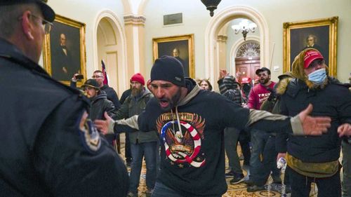 Trump-supporting rioters storming the US Capitol.