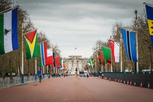 The Mall in Central London is closed and lined with national flags in preparation for the arrival of leaders for the 2018 Commonwealth Heads of Government Meeting and for the London marathon. (AAP)