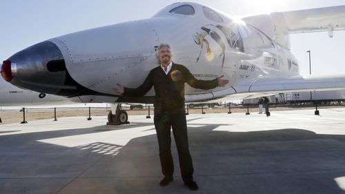 "Space feels tantalisingly close now," founder Richard Branson tweeted. He is pictured with SpaceShipTwo in Mojave in September 2013. (AAP)