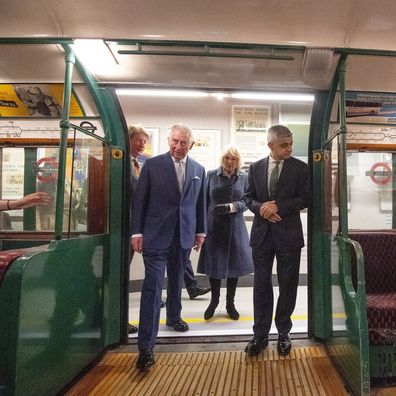 LONDON, ENGLAND - MARCH 04: Prince Charles, Prince of Wales, Camilla, Duchess of Cornwall and Mayor of London Sadiq Khan (R) step onto an old London tube carriage during a visit to the London Transport Museum to mark 20 years of Transport for London on March 4, 2020 in London, England. (Photo by Victoria Jones - WPA Pool/Getty Images)