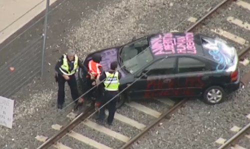 The car was emblazoned with messages protesting the treatment on Manus Island refugees. (9NEWS)