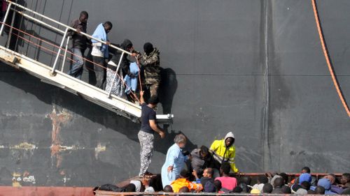 An oil tanker helped rescue about 135 people from boats off the Libyan coast. (AFP)
