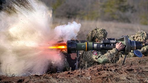 A Ukrainian serviceman fires an NLAW anti-tank