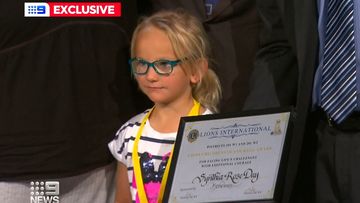 Synthia Braddock, five, was honored with a Children of Courage award for looking after her two younger brothers for 55 hours after a Christmas Day crash killed their parents.