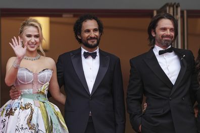 Maria Bakalova, from left, director Ali Abbasi, and Sebastian Stan pose for photographers upon arrival at the premiere of the film 'The Apprentice' at the 77th international film festival, Cannes, southern France, Monday, May 20, 2024 